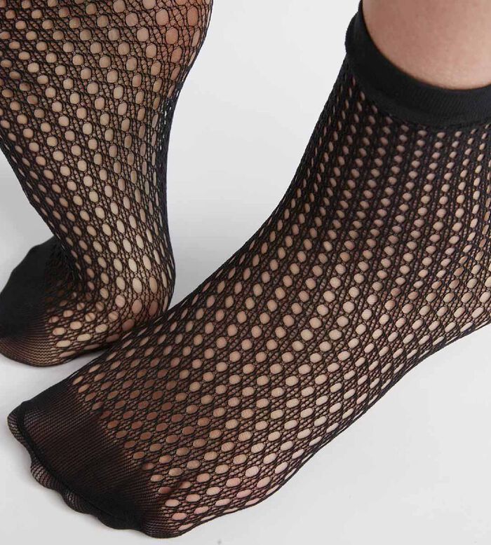 Fishnet tights and knee-highs